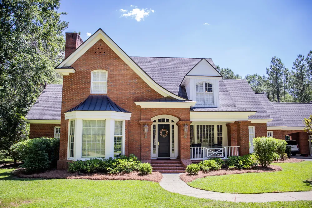 Charming brick house with lush greenery